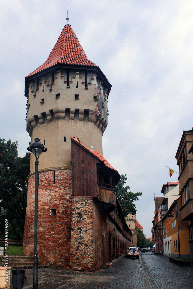 Watchtower and street at Sibiu, Romania at central perspective image, after rain.
