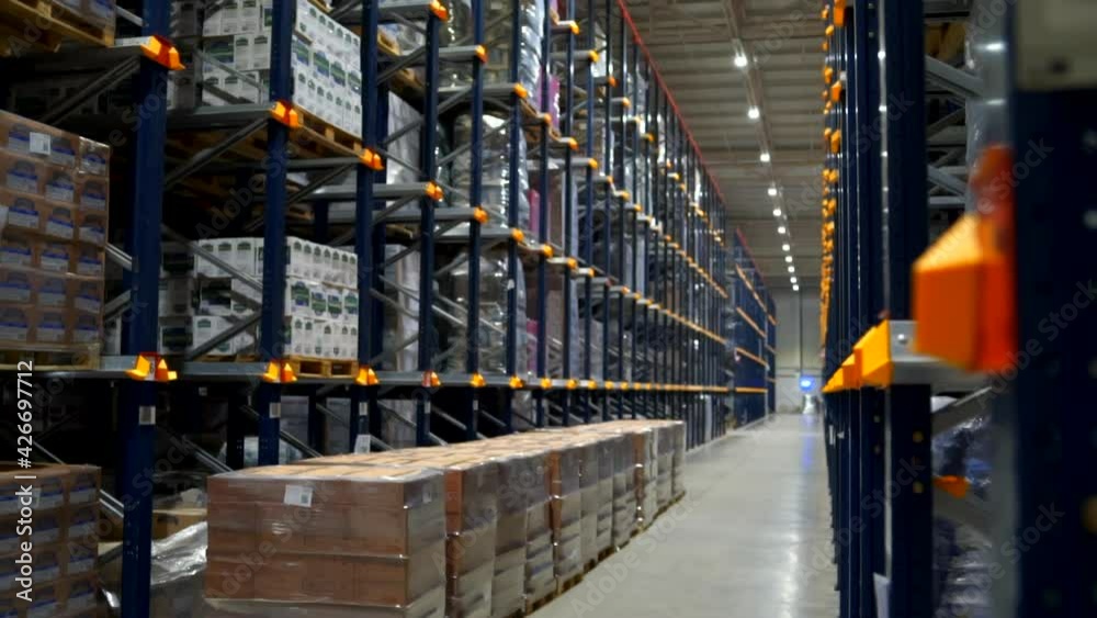 View on the endless industry racks with a food product boxes folded at factory storage of transport department