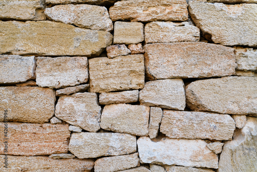 Old castle stone wall as texture or background for photo and graphic design Old castle stone wall as texture or background for photo and graphic design