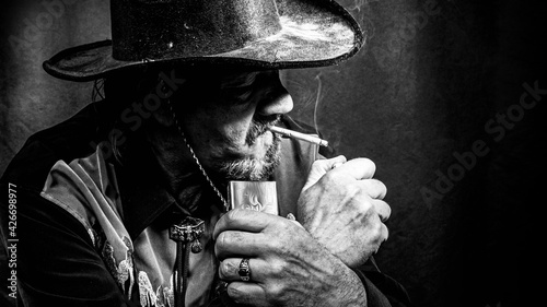 cowboy smokes photo