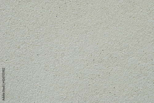 Raw concrete surface in unpainted pale earth tone color. Minimal and peaceful feeling image background. 