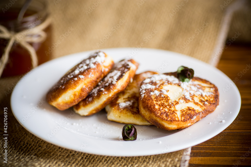 sweet fried cottage cheese pancakes in a plate