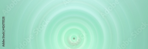Abstract round green background. Circles from the center point. Image of diverging circles. Rotation that creates circles.