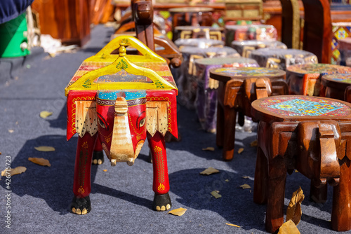 Colorful designer table furniture made with wood in Hunar Haat fair. photo