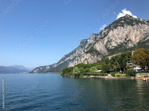 Beautiful landscape, panoramic view of mountain and lake Como in Lecco city, Italy, blue water and clear sky background