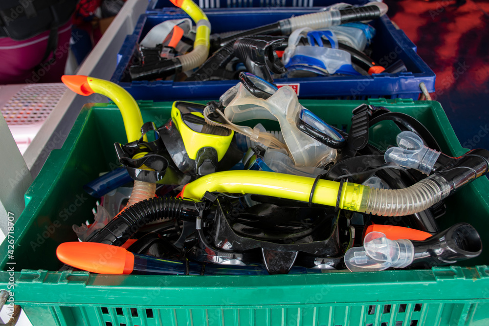 Fototapeta premium Colorful snorkel mask in plastic crate.