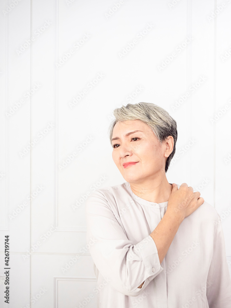 Sick senior adult elderly women touching the neck have shoulder and neck pain.Healthcare and medicine concept Sick senior adult elderly women touching the neck have shoulder and neck pain.Healthcare and medicine concept