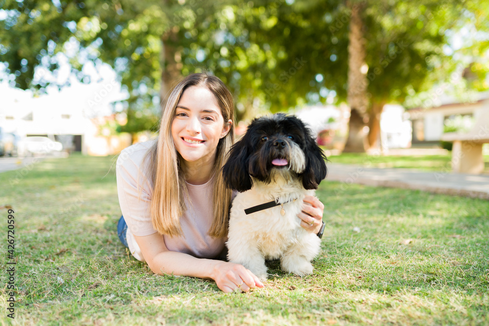 Attractive woman and her puppy feeling happy Attractive woman and her puppy feeling happy