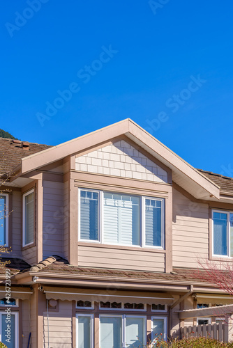 Top of a very neat and colorful home with gorgeous outdoor landscape in suburbs of Vancouver, Canada © karamysh