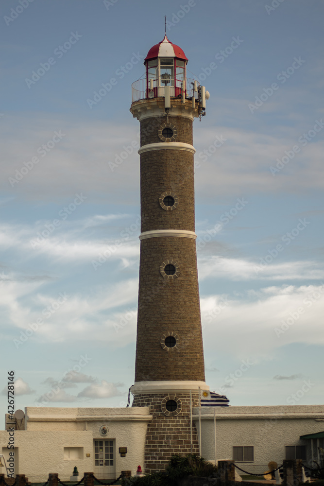 brick lighthouse with a uruguay flag