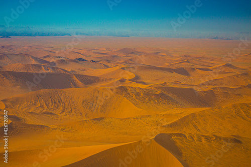 Sand dunes of Namib Naukluft National Park from hot-air balloon early in the morning, Namibia.