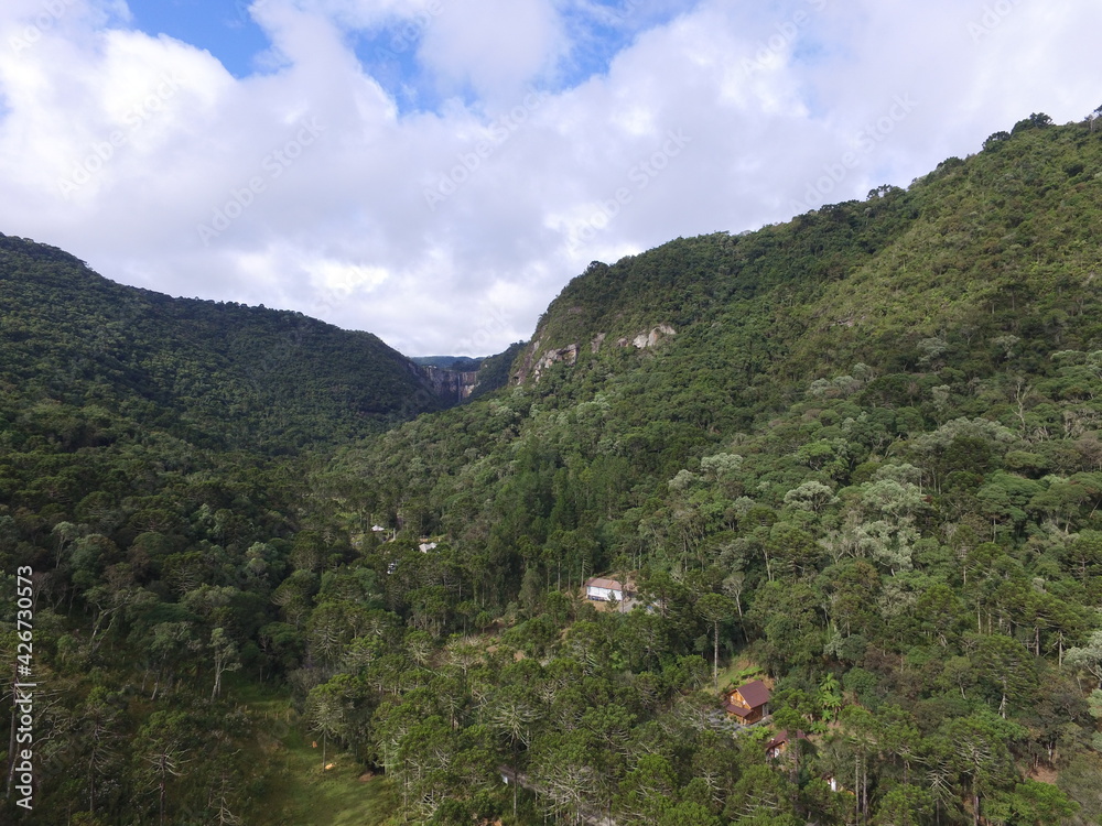 Fototapeta premium valley with a waterfall in the end