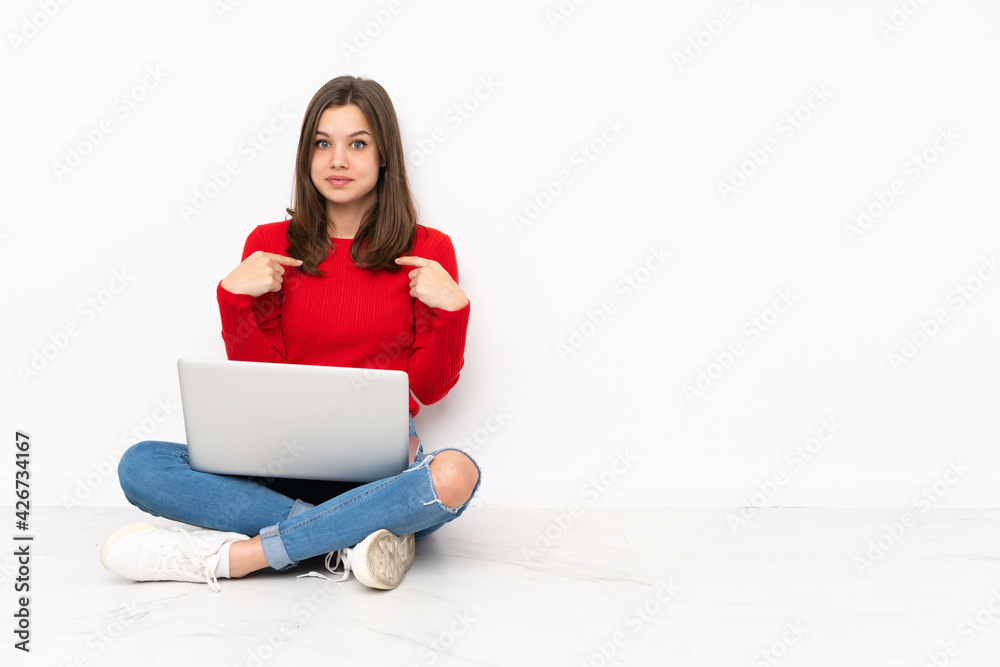 Tenaager girl working with pc isolated on white background with surprise facial expression Tenaager girl working with pc isolated on white background with surprise facial expression