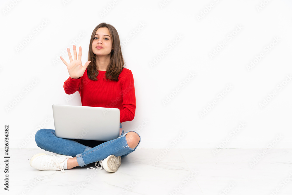 Tenaager girl working with pc isolated on white background counting five with fingers Tenaager girl working with pc isolated on white background counting five with fingers