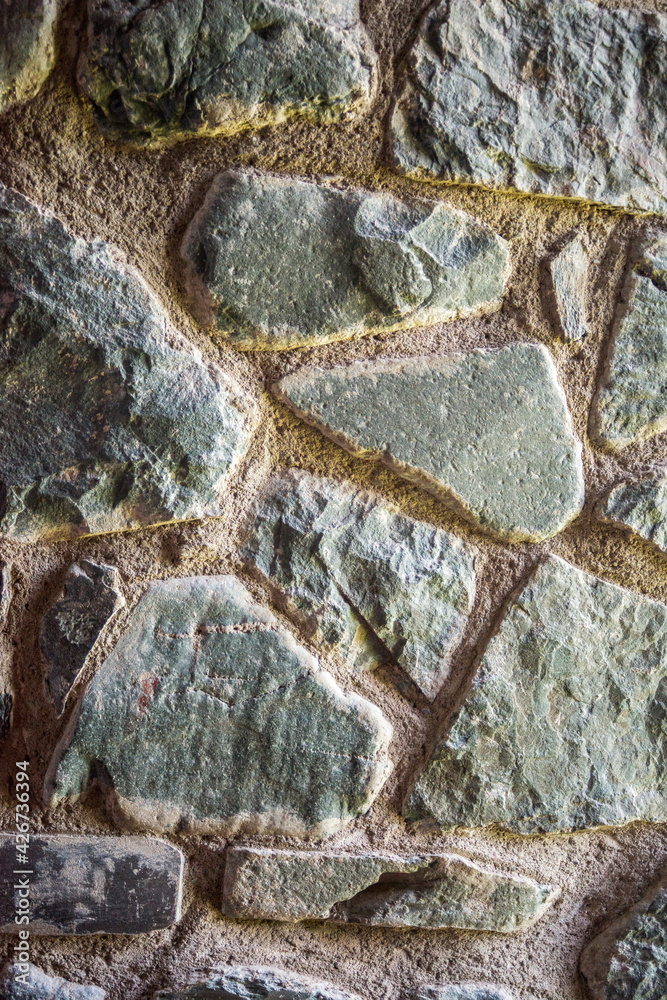 Fototapeta premium bluish-green stone wall