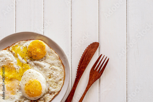 Billede på lærred Food background with sunny side up eggs for tasty breakfast.