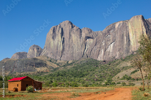 A village house in front of Wonderful Tsaranoro mountain in front of the village building, View from the village; Andringitra national park  in Madagascar photo