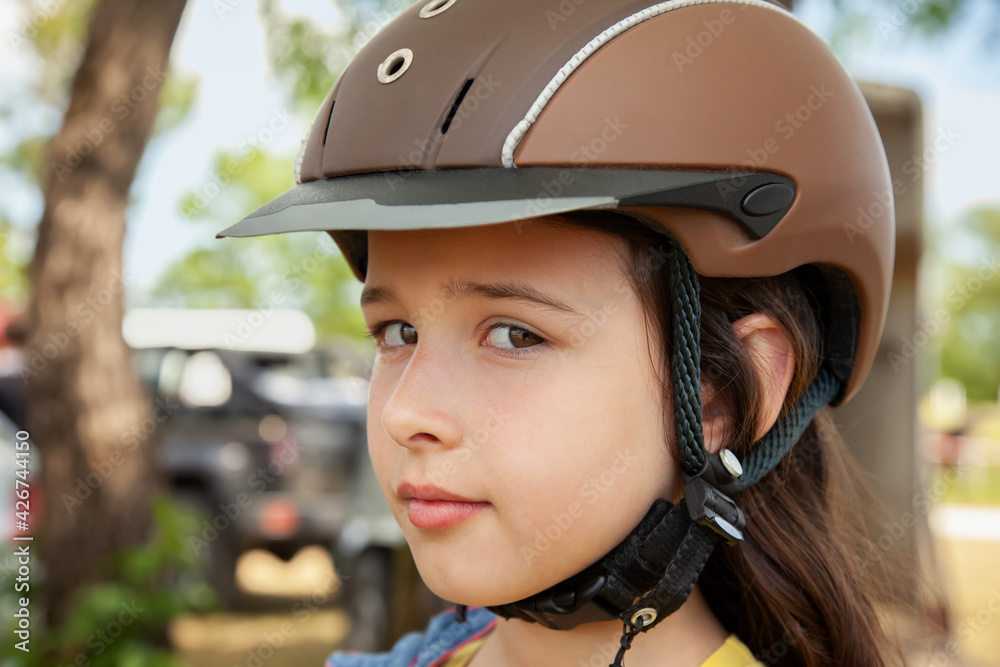 Close up of a Girl Waiting for a Horse Riding Lesson Close up of a Girl Waiting for a Horse Riding Lesson