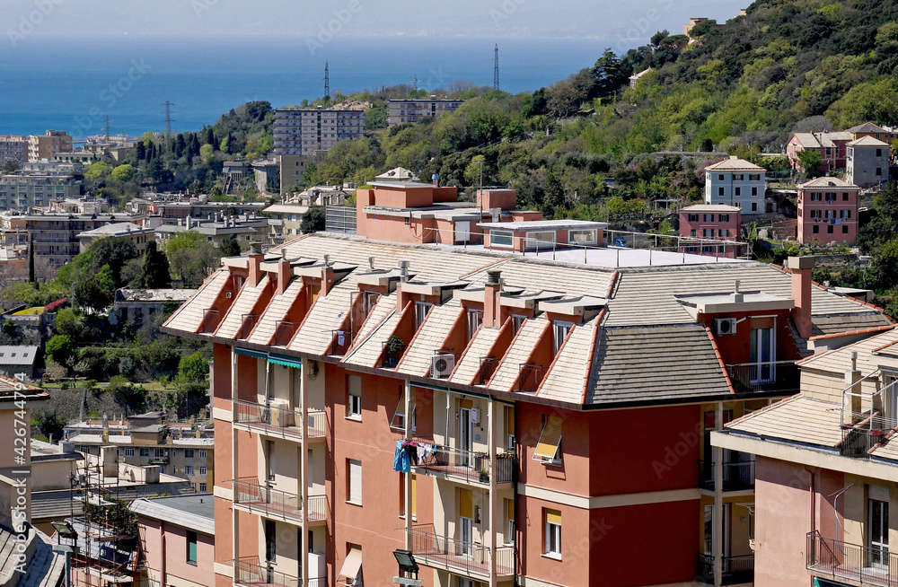 Fototapeta premium Residential houses in the hills with sea view