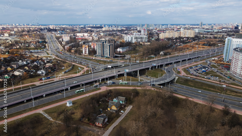 Fototapeta premium Large transport interchange in a big city. There is a lot of public transport on the road. Aerial photography.