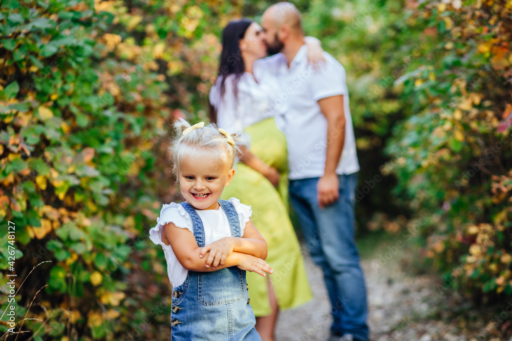 Happy family on a walk in the autumn forest. Happy family on a walk in the autumn forest.