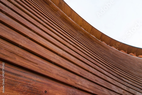 Abstract architecture. Close up of a wooden building facade.