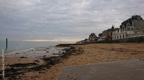 Houses at Arromanches  in Normandy  France . Normandy D-Day Landing Beaches in France on a cold and cloudy winter day. 