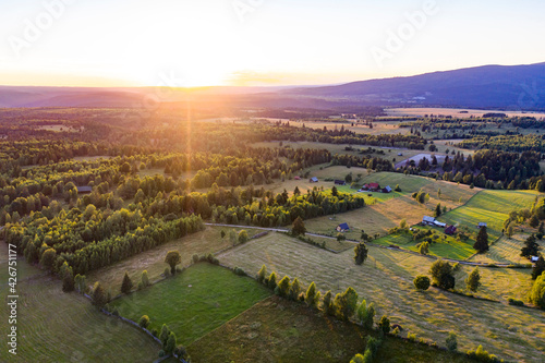 Fototapeta Naklejka Na Ścianę i Meble -  Aerial of beautiful sunset over agricultural fields.