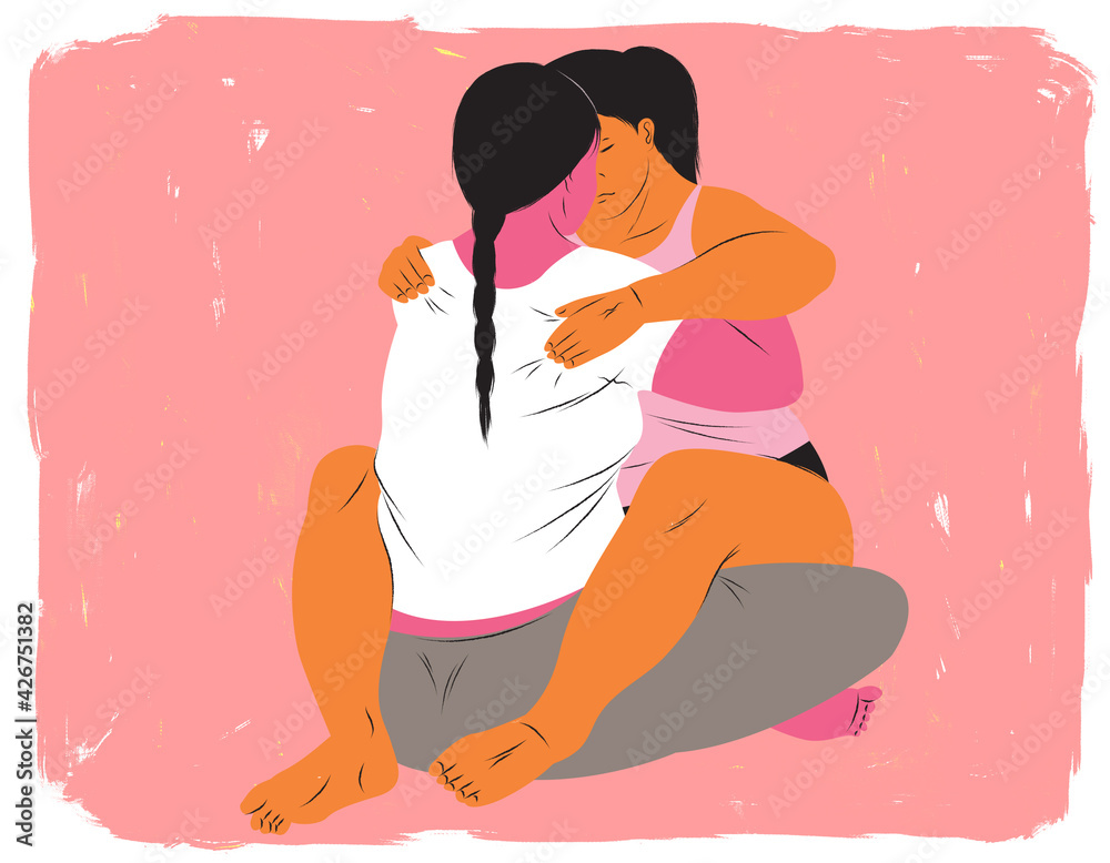 Doula holding a mother in labor closely during contraction Doula holding a mother in labor closely during contraction