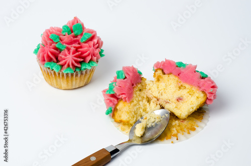Broken cupcake isolated in white background