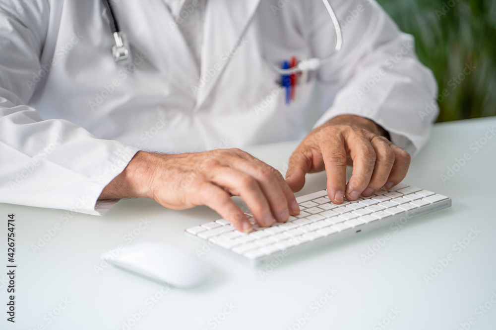 Close up of a Doctor working in his office or home. Close up of a Doctor working in his office or home.
