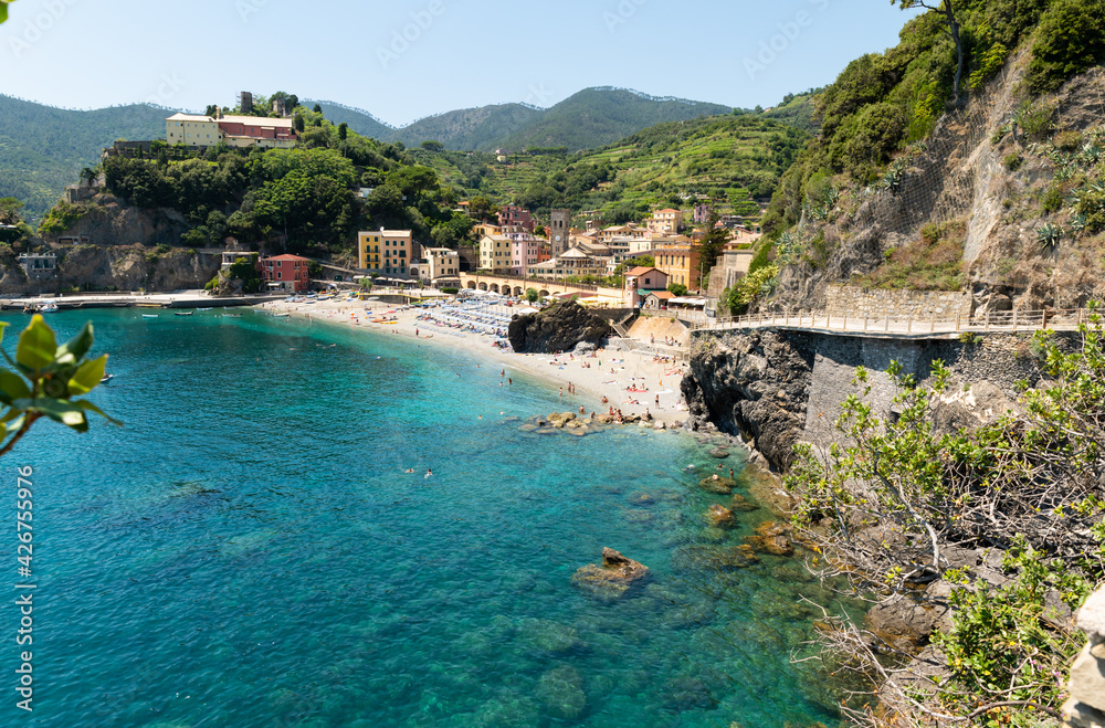 Monterosso, Liguria, Italy, June 2020. A view of the village from the top of the via dell'amore: amazing corner of the coast with crystal clear waters and wild nature. Beautiful summer day.