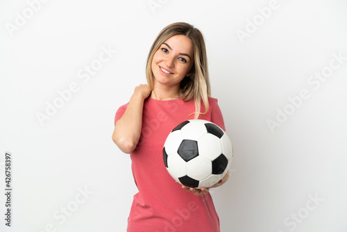 Young football player woman over isolated white wall laughing © luismolinero