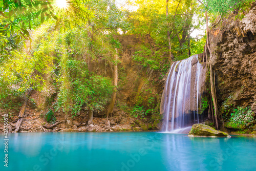 Tropical landscape with beautiful waterfall  wild rainforest with green foliage and flowing water
