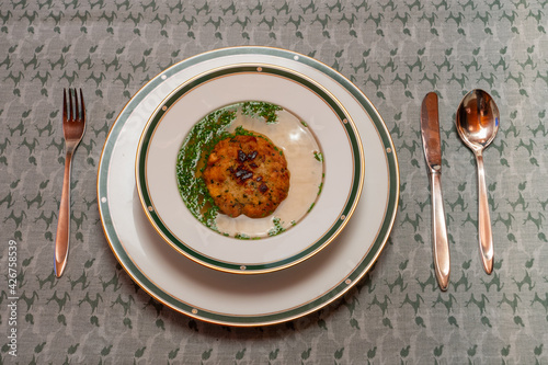 Kaspressknoedelsuppe, Beef Broth with Cheese Dumpling, a Traditional Soup from Western Austria photo