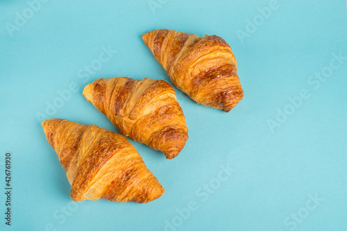 Continental breakfast with gold french croissants and cup of tea