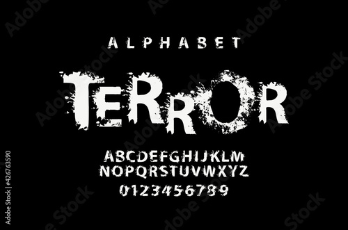 TERROR lettering in abstract letters with spots. Grunge-style splash Alphabet, vector set of white alphabet letters and numbers on a black background. Creative font for headline, poster, label, logo