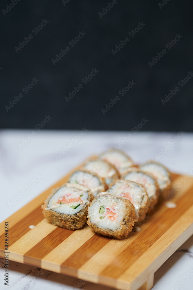 Sushi Rolls on the board beautiful view
Sushi Rolls on the board beautiful view