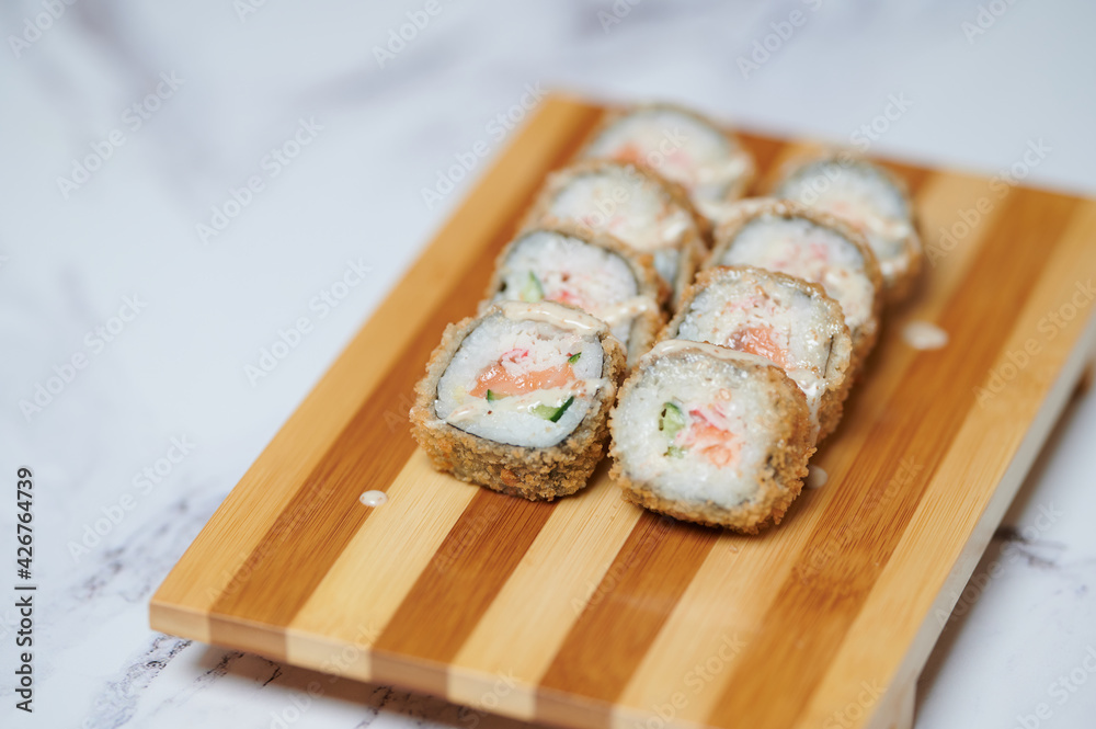 Sushi Rolls on the board beautiful view
Sushi Rolls on the board beautiful view