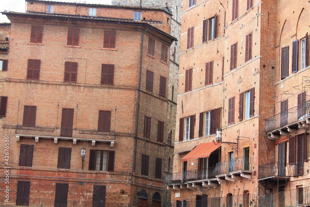 Typical brick houses in Siena, Italy