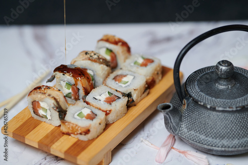 Sushi Rolls on the board beautiful view
 photo