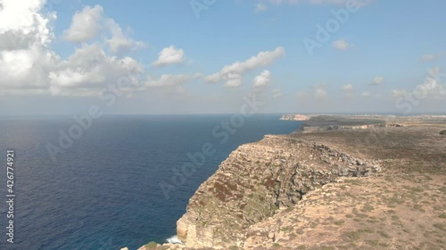 Aerial shot Lampedusa Island (Drone 4k), seagulls, isola dei conigli at sunset - concept of paradise on earth, happiness and travel to beautiful places photo