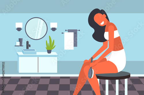 attractive girl massaging skin of her legs with a brush for dry massage cellulite treatment dry brushing skincare concept modern bathroom interior horizontal vector illustration