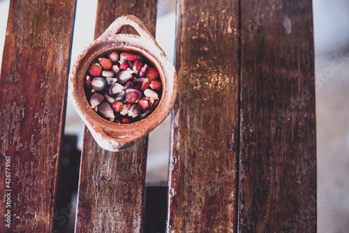 Chile seeds in ceramic dish on a wooden table at a Mexican restaurant photo