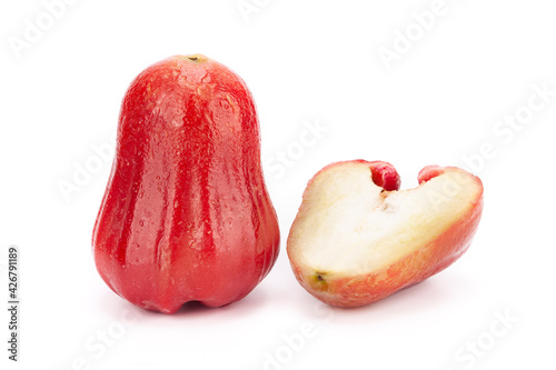 One whole and half java apple on white background, isolated