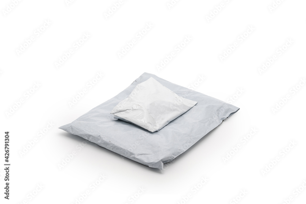 Isolated Postal Package from shopping online, is delivered to the buyer. It's shot in the studio light in front of white background. Clipping Paths. Isolated Postal Package from shopping online, is delivered to the buyer. It's shot in the studio light in front of white background. Clipping Paths.