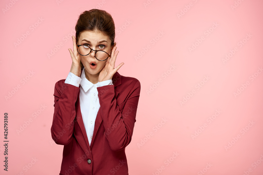 Elegant woman in suit and glasses official pink background Elegant woman in suit and glasses official pink background