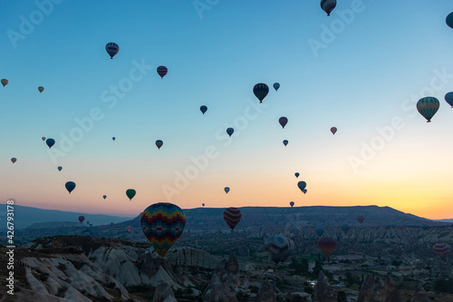 Daily take-off of balloons in Cappadocia, on the city of Goreme, Turkey.
