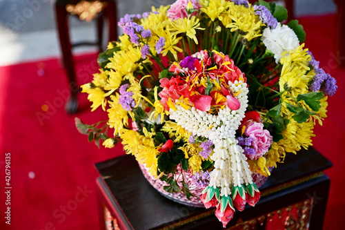 Fototapeta Naklejka Na Ścianę i Meble -  Thai traditional flower garland on fresh flowers for blessing ceremony of adults in Songkran festival or Thai new year in Thailand. 