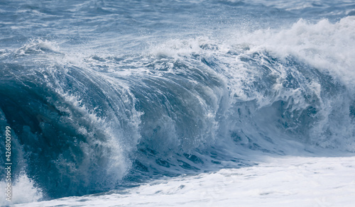 Splashing big waves on the seashore.